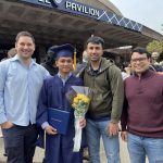 Group photo at Bivek's graduation for masters at the UConn basketball arena Gampel